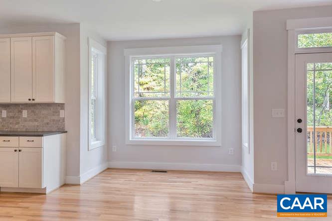 128 Wexford Ridge Road Ruckersville, VA 22968 - Photo 10 of 19 a view of an empty room with wooden floor and a window