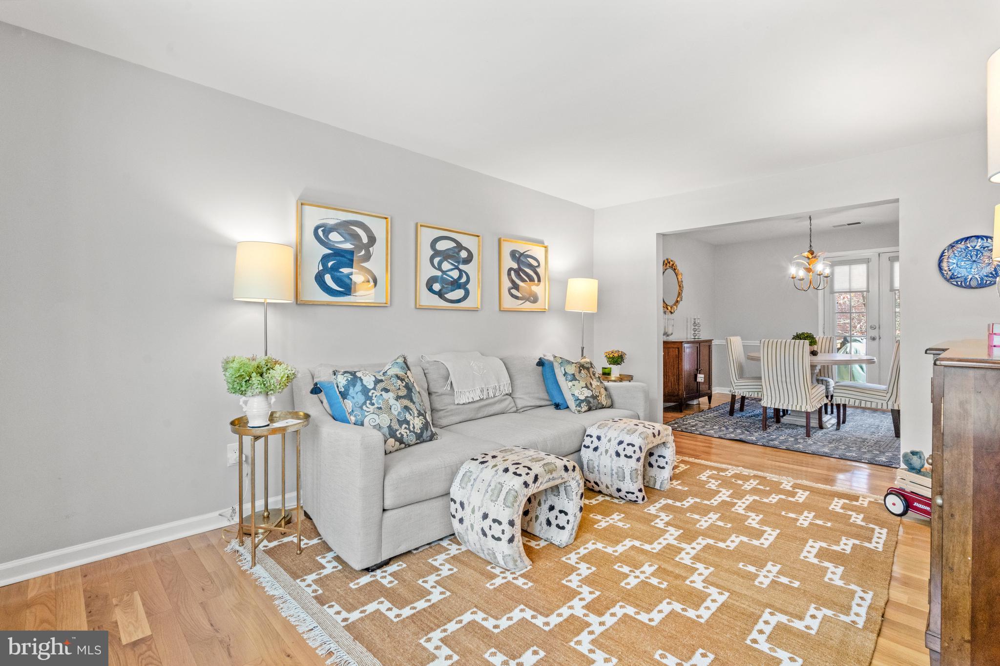 6691 Fairfax Road, Unit 80 Chevy Chase, MD 20815 - Photo 3 of 22 Sun-filled Living Room Leading into Dining Room
