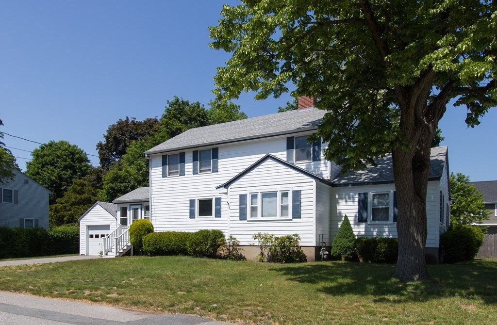 28 Norman Road Hamilton, MA 01982 - Photo 1 of 19 a front view of a house with a yard