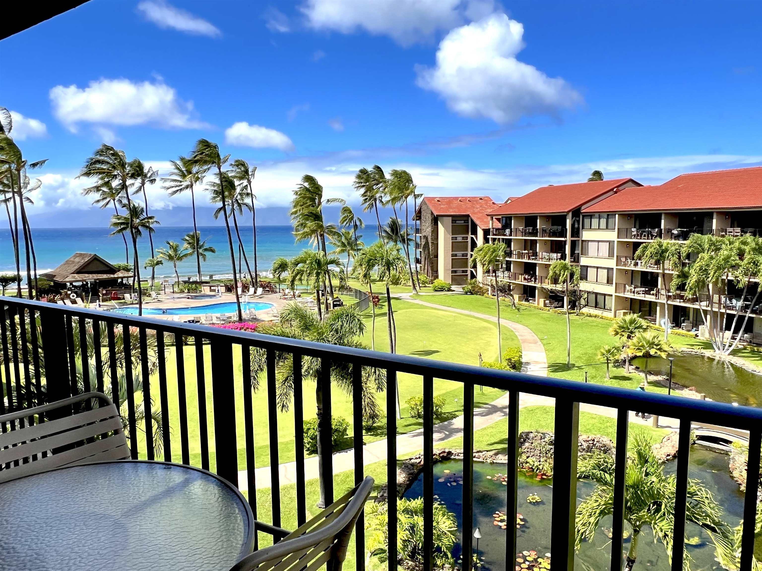 3543 Lower Honoapiilani Road, Unit J403 Lahaina, HI 96761 - Photo 1 of 23 a view of a city from a balcony