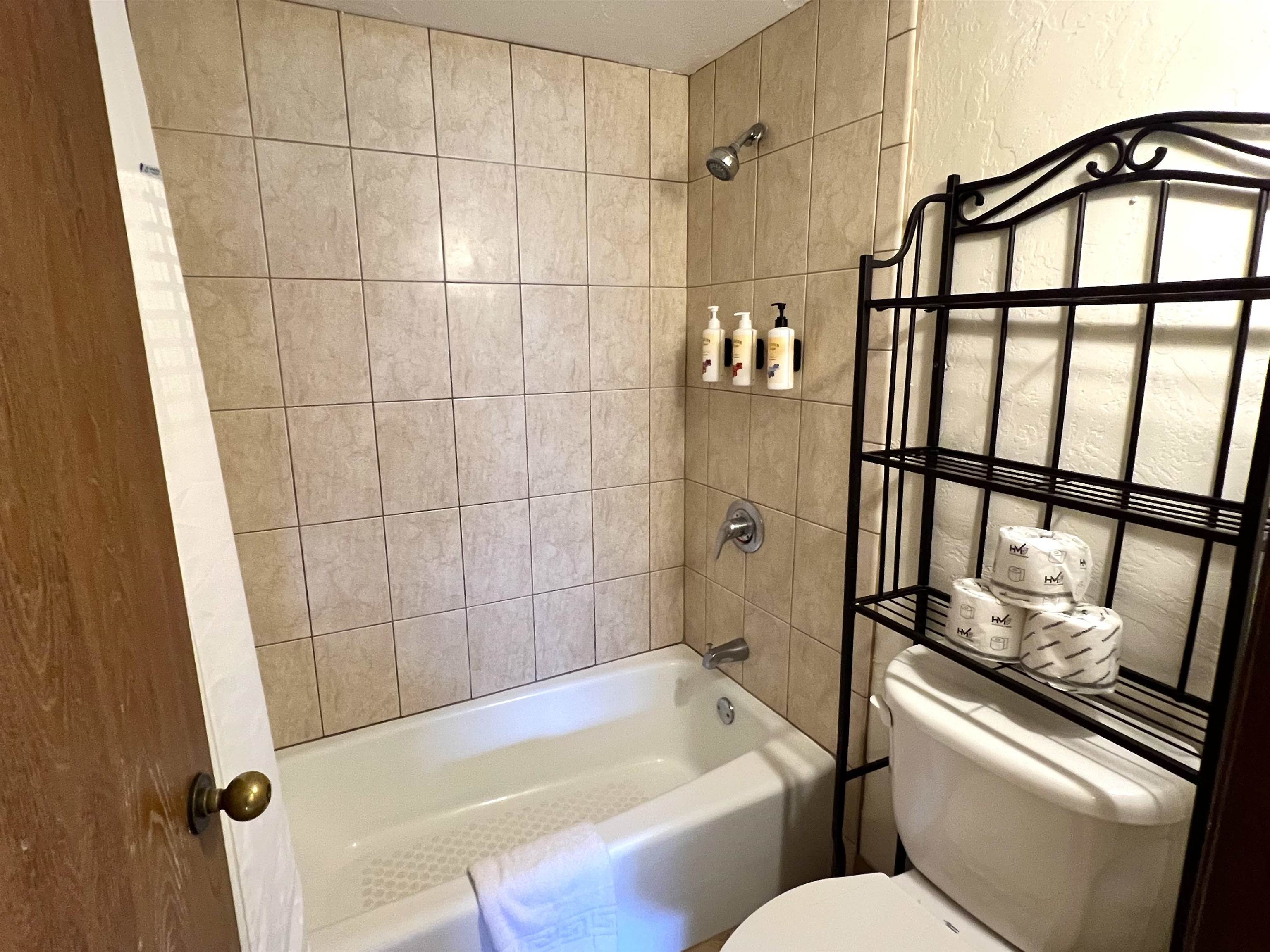 3543 Lower Honoapiilani Road, Unit J403 Lahaina, HI 96761 - Photo 15 of 23 a bathroom with a tub and shower