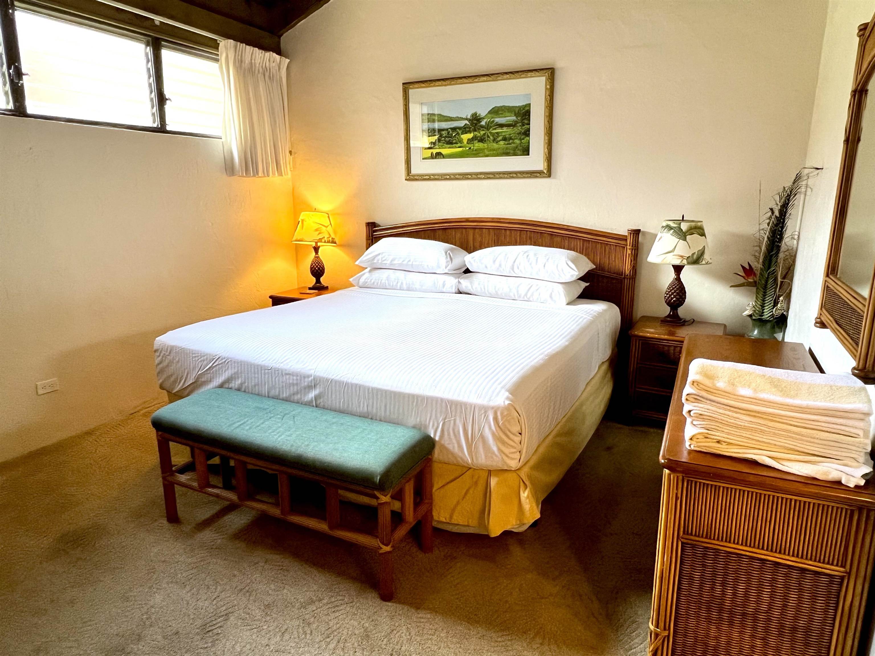 3543 Lower Honoapiilani Road, Unit J403 Lahaina, HI 96761 - Photo 10 of 23 a bedroom with a bed and a window