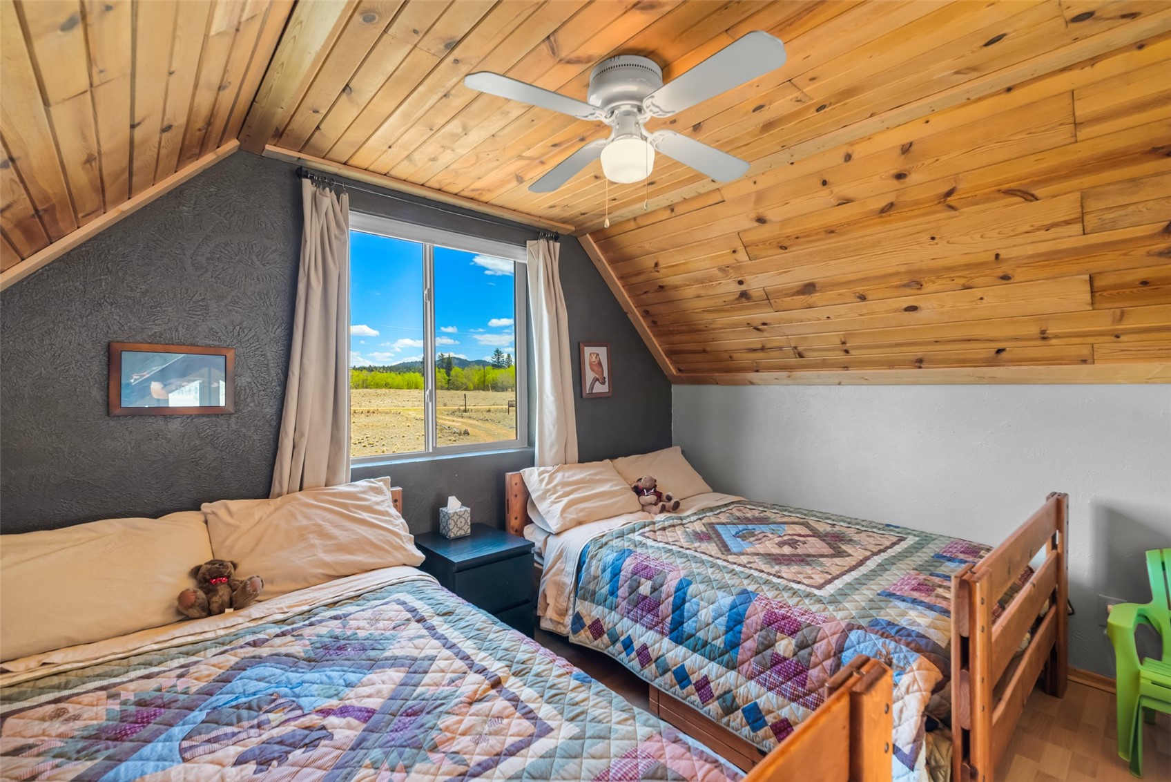 15 Mallard Road Como, CO 80432 - Photo 45 of 49 a bedroom with a bed and a window