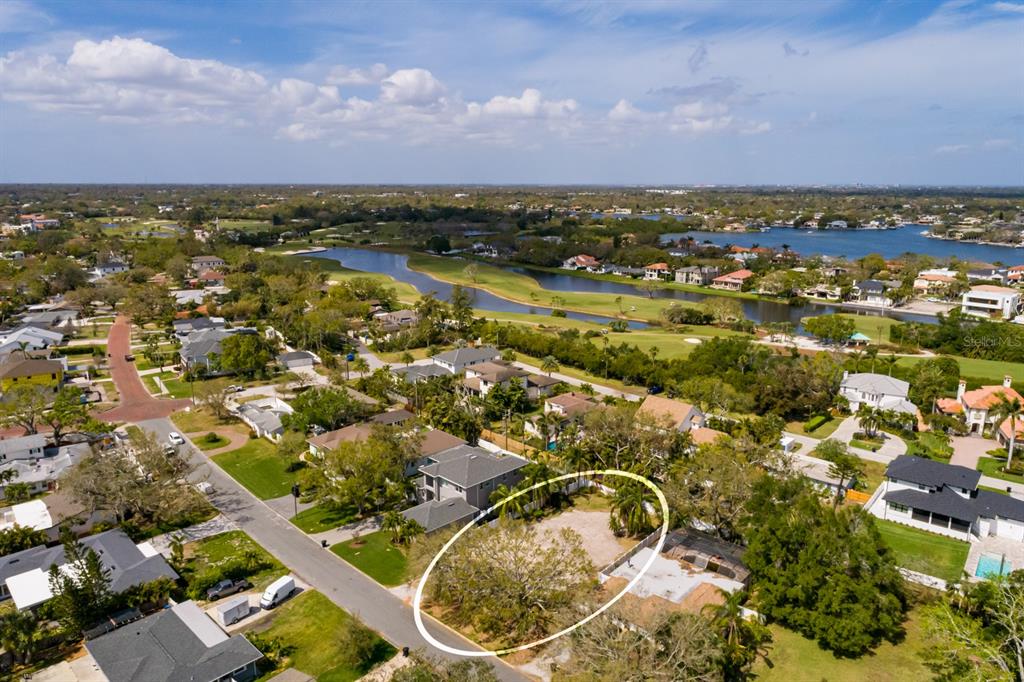446 Rafael Boulevard Northeast St. Petersburg, FL 33704 - Photo 11 of 20 an aerial view of residential houses with outdoor space and trees