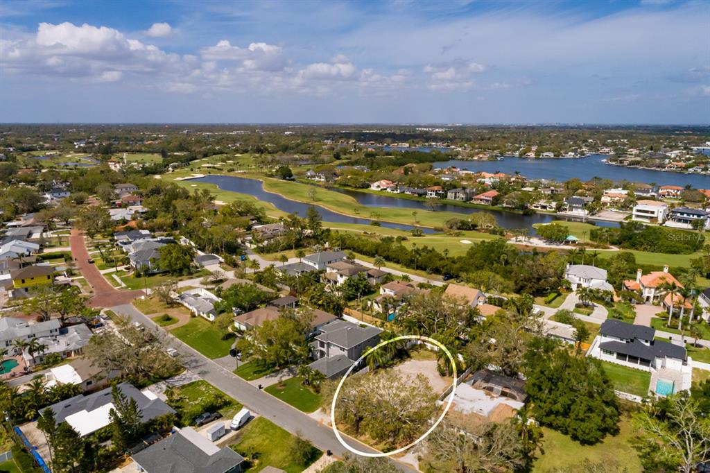 446 Rafael Boulevard Northeast St. Petersburg, FL 33704 - Photo 20 of 20 an aerial view of residential houses with outdoor space and trees