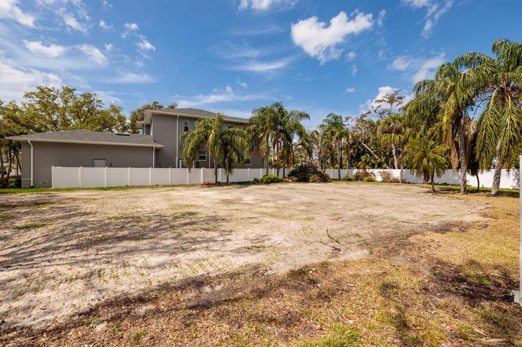 446 Rafael Boulevard Northeast St. Petersburg, FL 33704 - Photo 5 of 20 a view of swimming pool with a yard