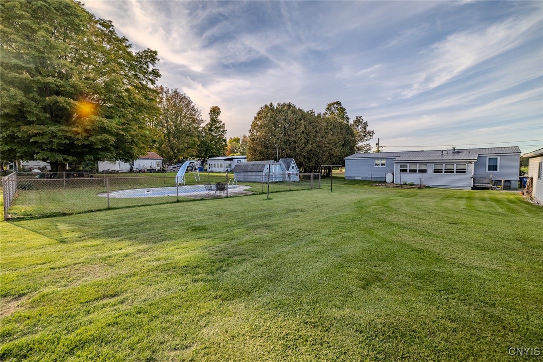 470 Chatfield Road Elbridge, NY 13060 - Photo 29 of 32 Expansive flat backyard with a fenced in in-ground