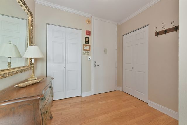a view of a kitchen with a sink and a refrigerator