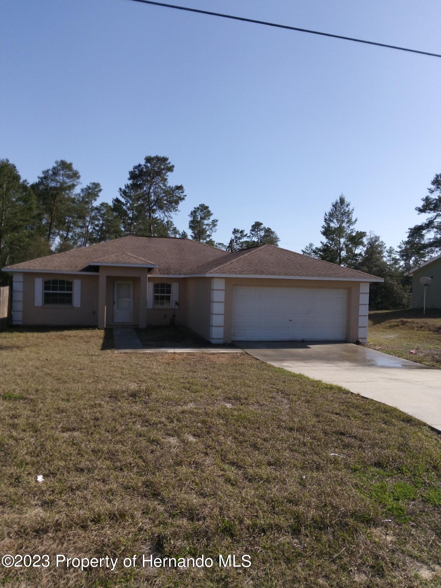 2790 Southwest 165th Street Road Ocala, FL 34473 - Photo 1 of 55 a front view of a house with a yard