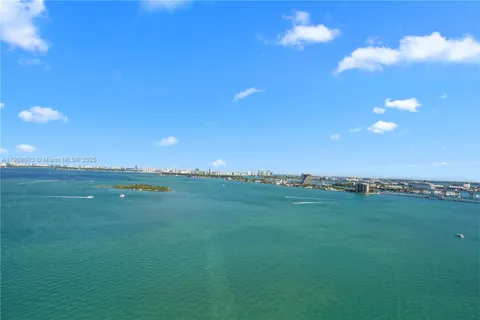 a view of an ocean and a yard