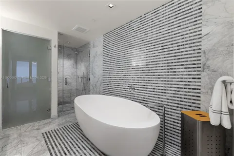 a white toilet sitting next to a bathroom sink