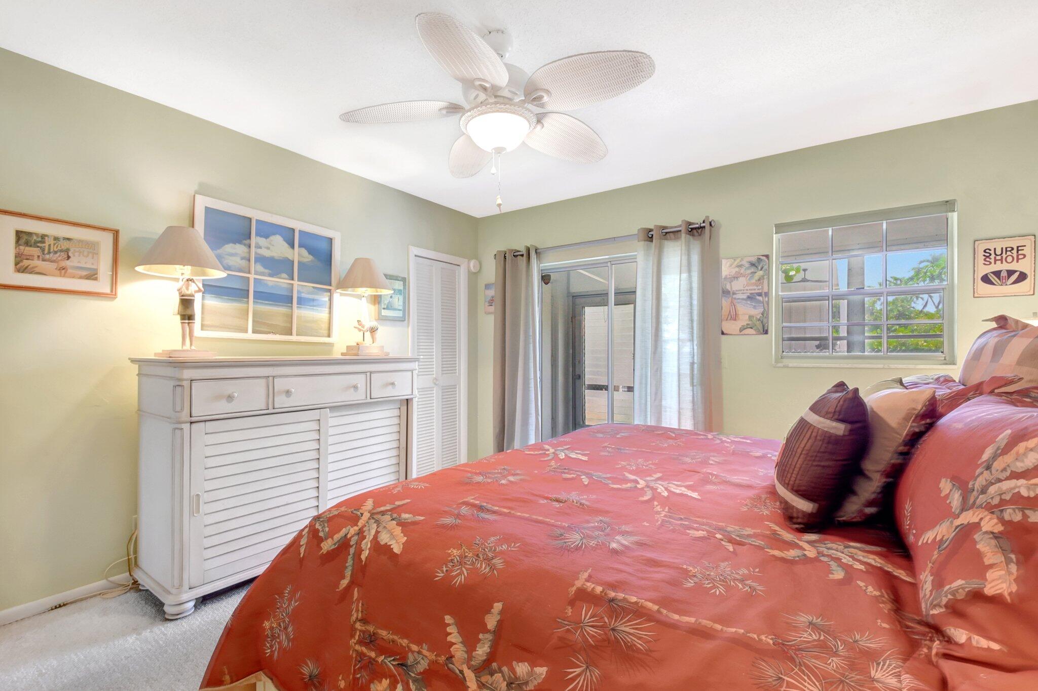 5505 North Ocean Boulevard, Unit 13105 Ocean Ridge, FL 33435 - Photo 21 of 40 a bedroom with a large bed and a window