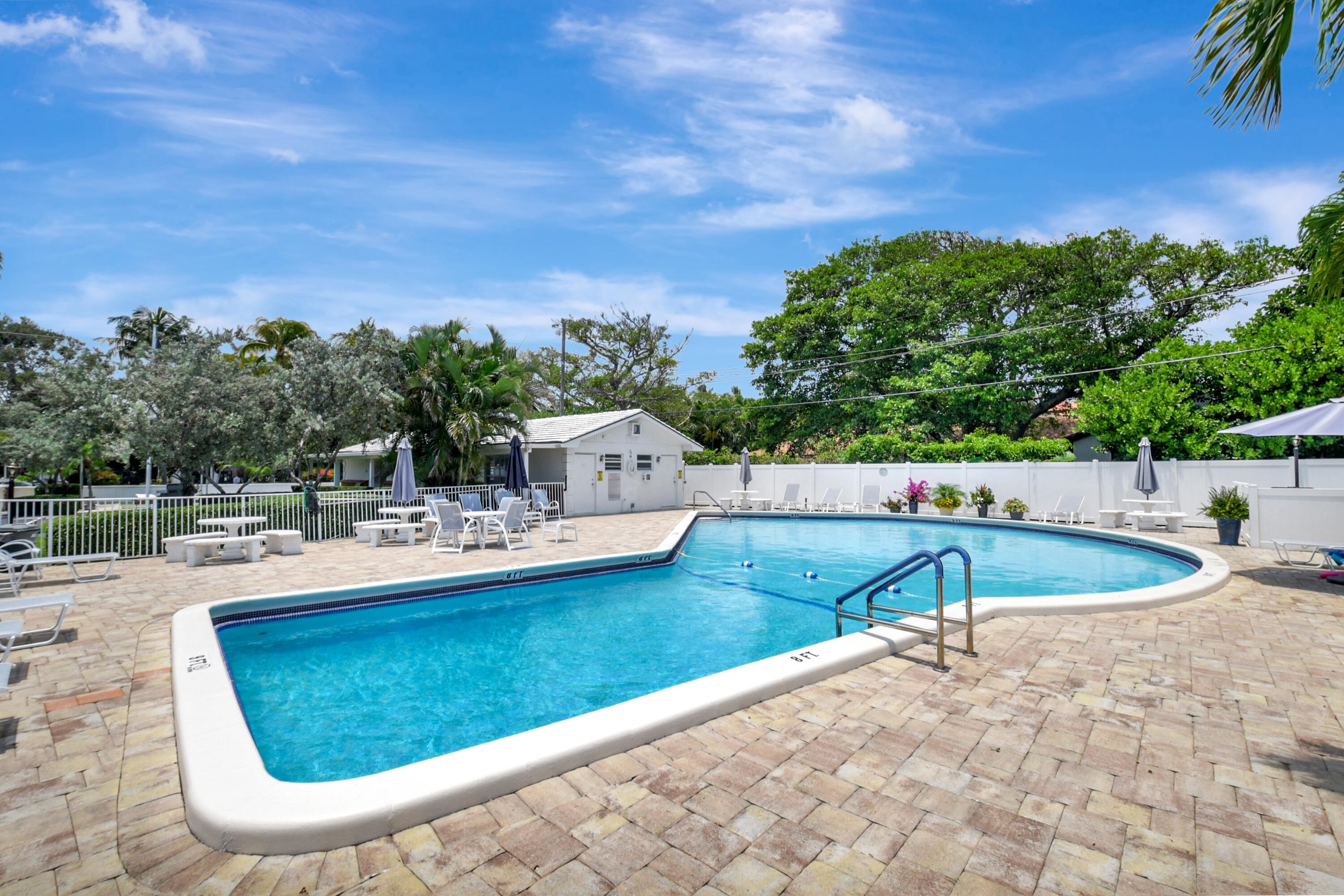 5505 North Ocean Boulevard, Unit 13105 Ocean Ridge, FL 33435 - Photo 30 of 40 a view of a swimming pool with a patio and a yard