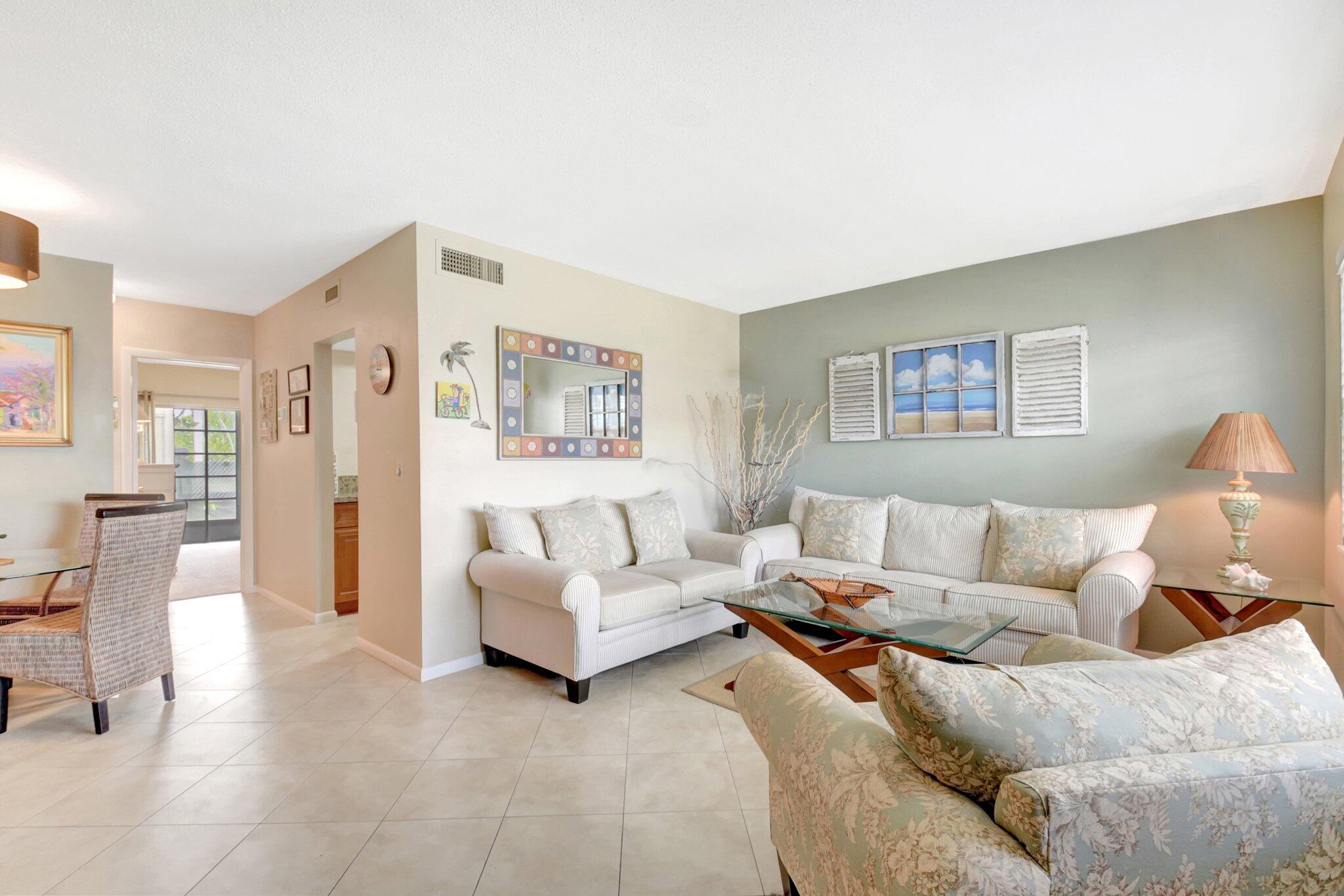 5505 North Ocean Boulevard, Unit 13105 Ocean Ridge, FL 33435 - Photo 8 of 40 a living room with furniture and a couch