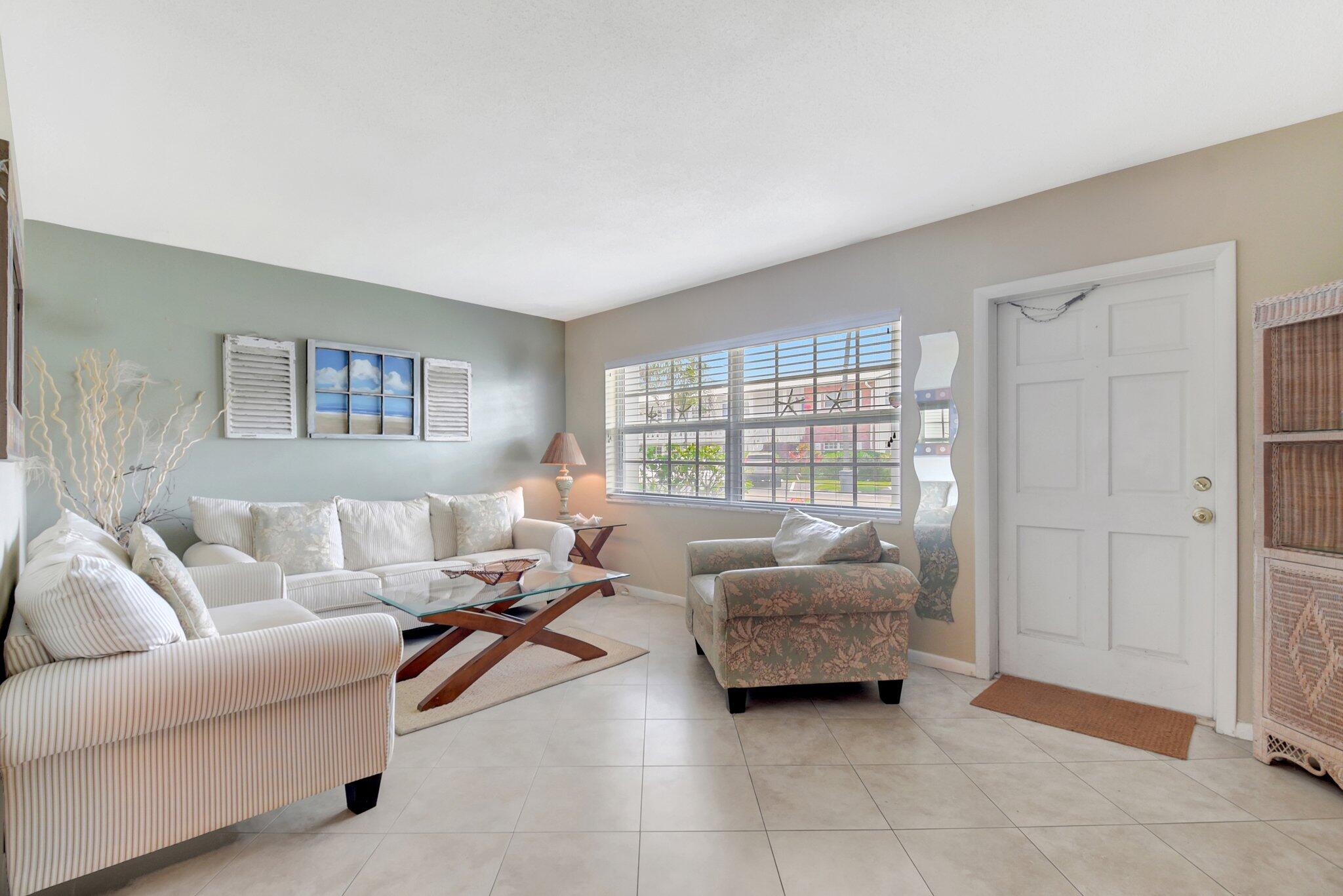 5505 North Ocean Boulevard, Unit 13105 Ocean Ridge, FL 33435 - Photo 10 of 40 a living room with furniture and a window