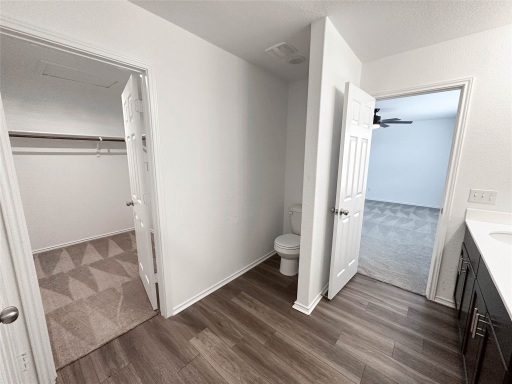 925 Duskywing Way Georgetown, TX 78626 - Photo 14 of 28 LVP flooring in primary bathroom
