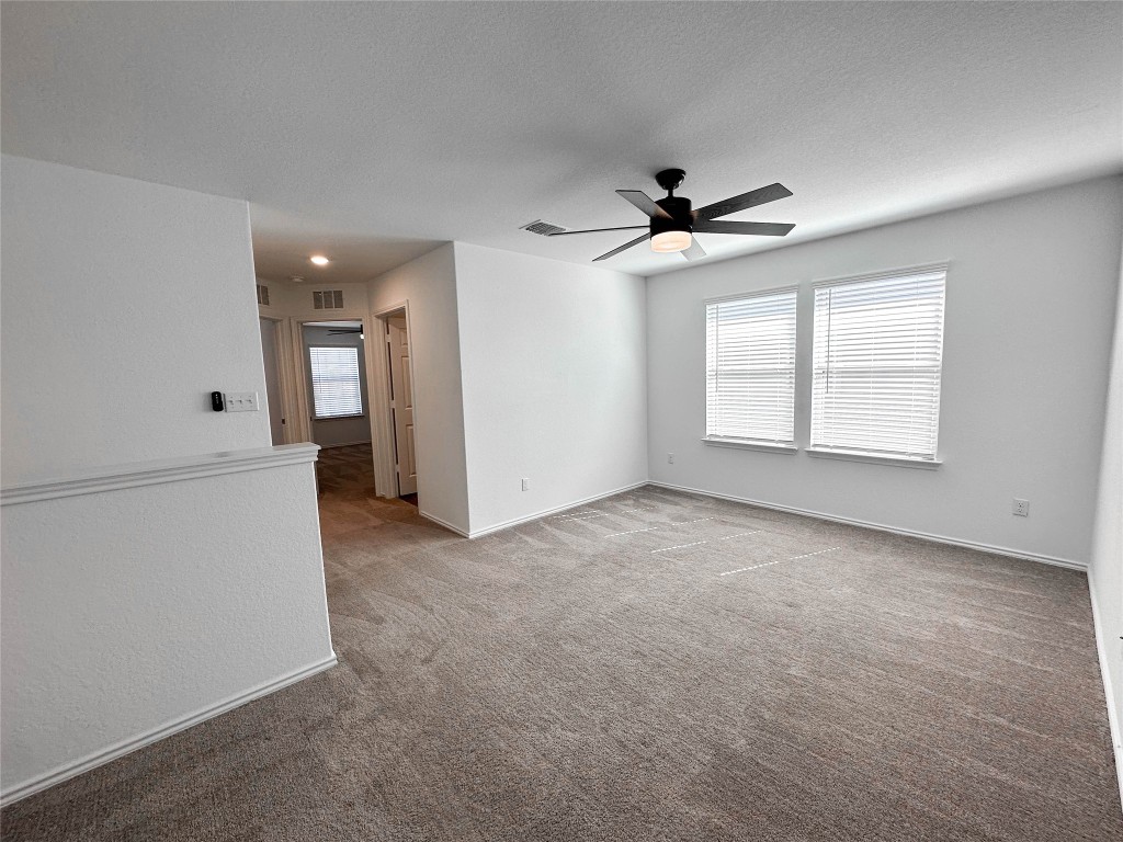 925 Duskywing Way Georgetown, TX 78626 - Photo 16 of 28 Upstairs living, leading to opposite side of home with secondary bedrooms