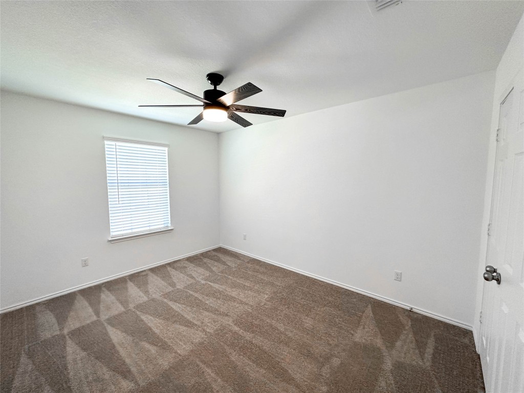 925 Duskywing Way Georgetown, TX 78626 - Photo 17 of 28 Secondary bedroom #1, facing front of home