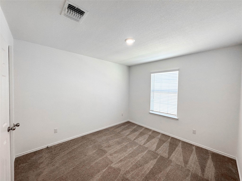 925 Duskywing Way Georgetown, TX 78626 - Photo 19 of 28 Secondary bedroom #2 facing front of home