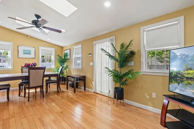 a bedroom with a bed and a mirror on dresser