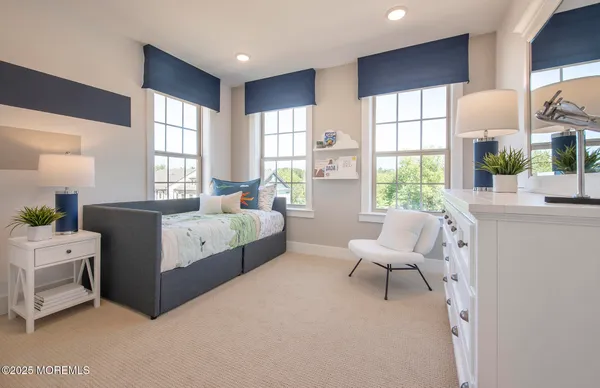 a living room with furniture and windows