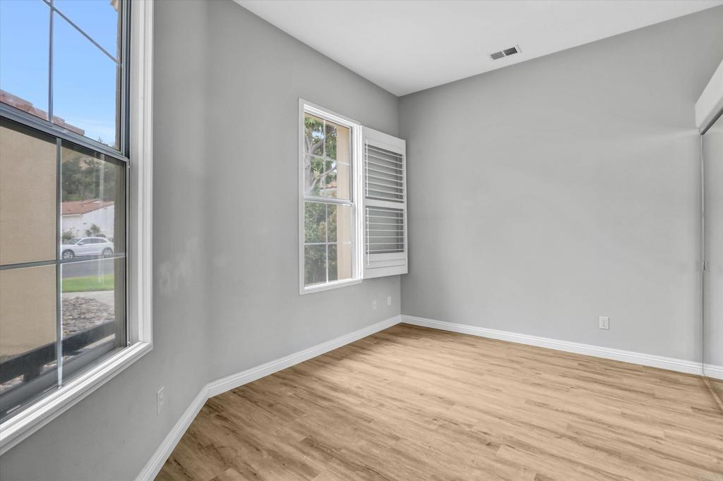 2318 Fallbrook Place Escondido, CA 92027 - Photo 18 of 34 a view of a room with wooden floor and fan