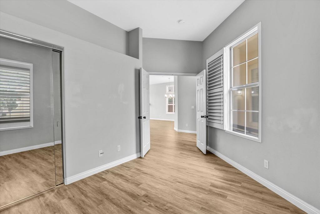 2318 Fallbrook Place Escondido, CA 92027 - Photo 19 of 34 a view of a room with wooden floor and windows