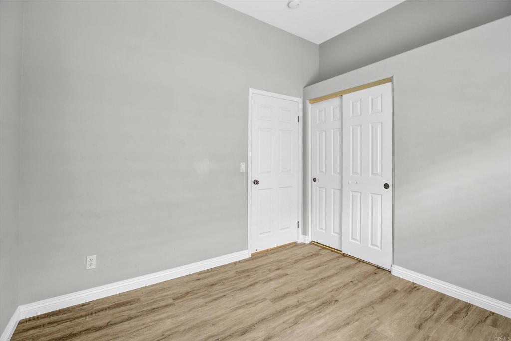 2318 Fallbrook Place Escondido, CA 92027 - Photo 21 of 34 a view of an empty room with wooden floor