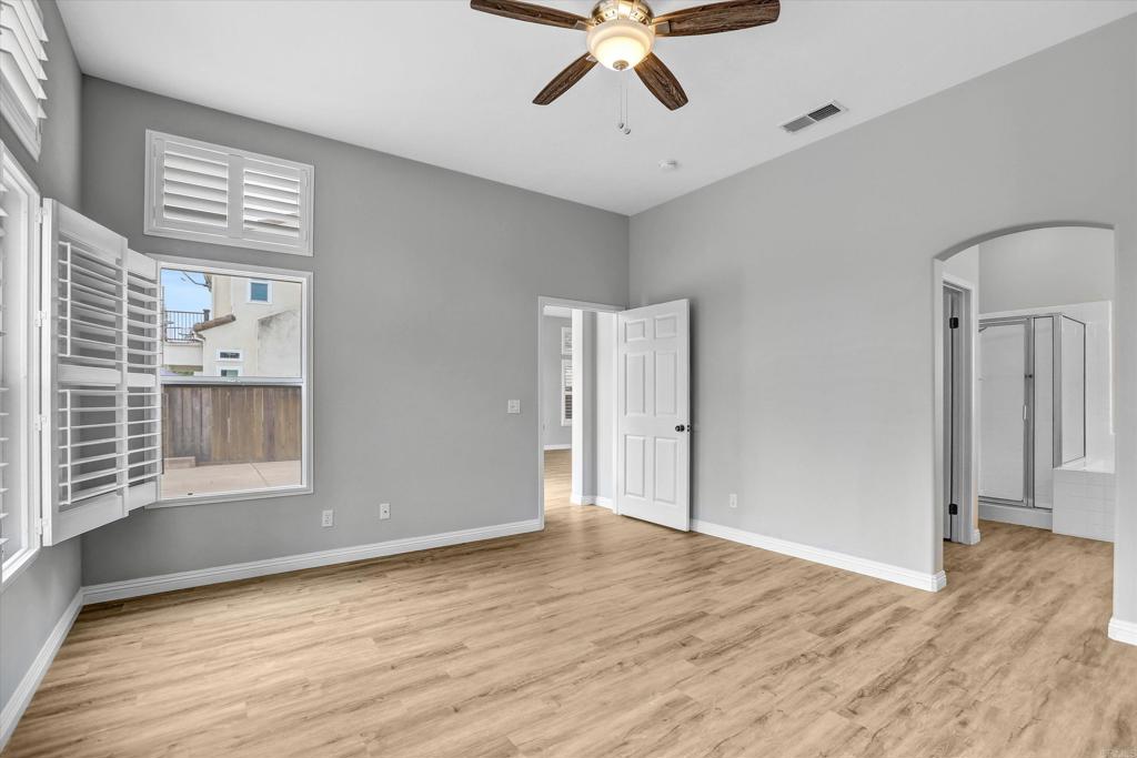 2318 Fallbrook Place Escondido, CA 92027 - Photo 24 of 34 wooden floor in an empty room with a window