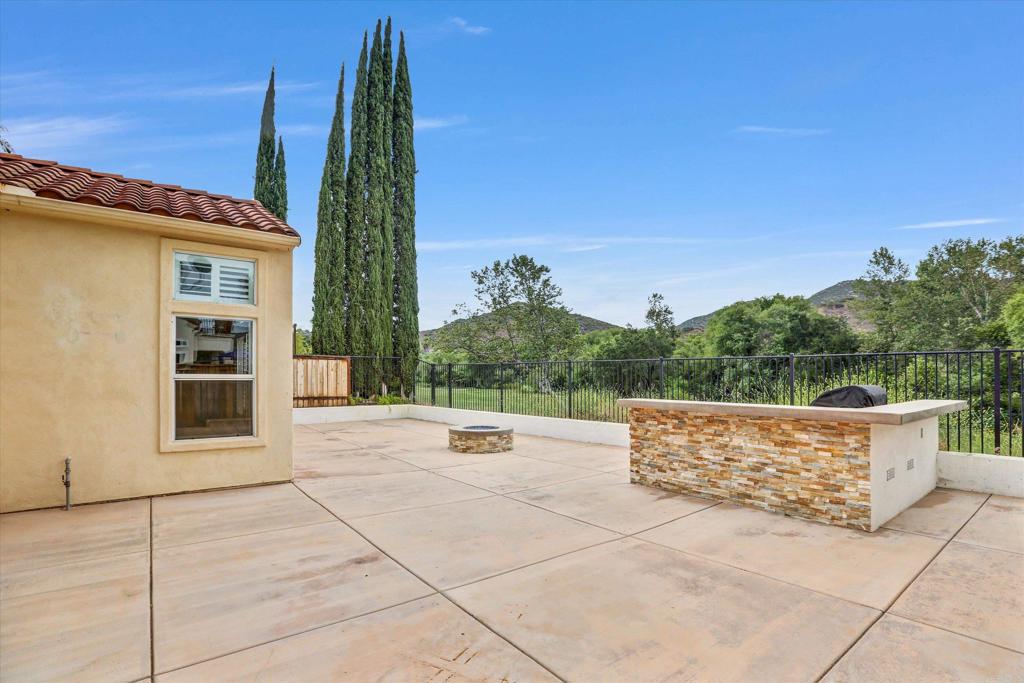 2318 Fallbrook Place Escondido, CA 92027 - Photo 27 of 34 a view of outdoor space with a car parked on the roadside