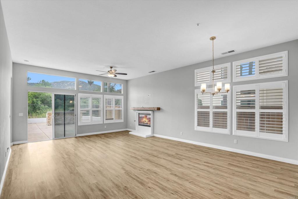 2318 Fallbrook Place Escondido, CA 92027 - Photo 6 of 34 a view of empty room with wooden floor and fan