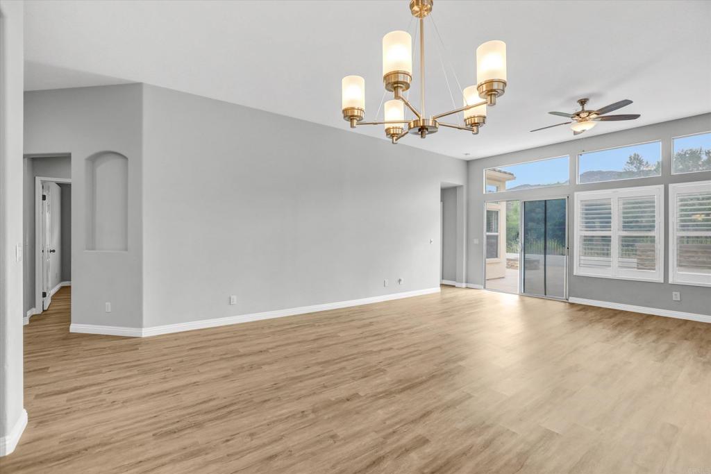2318 Fallbrook Place Escondido, CA 92027 - Photo 10 of 34 a view of an empty room with window and wooden floor