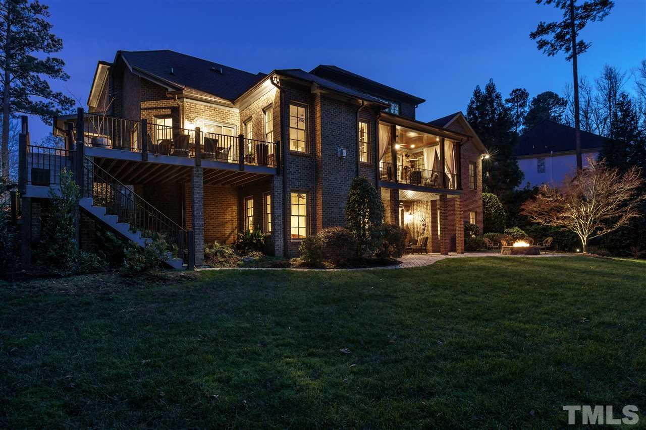 1512 Consett Court Raleigh, NC 27613 - Photo 2 of 30 Night view of this elegant custom home and all the generous outdoor living spaces.