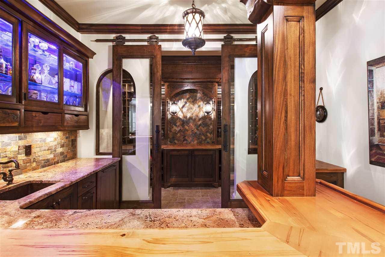 1512 Consett Court Raleigh, NC 27613 - Photo 20 of 30 Wine grotto with sliding glass barn doors