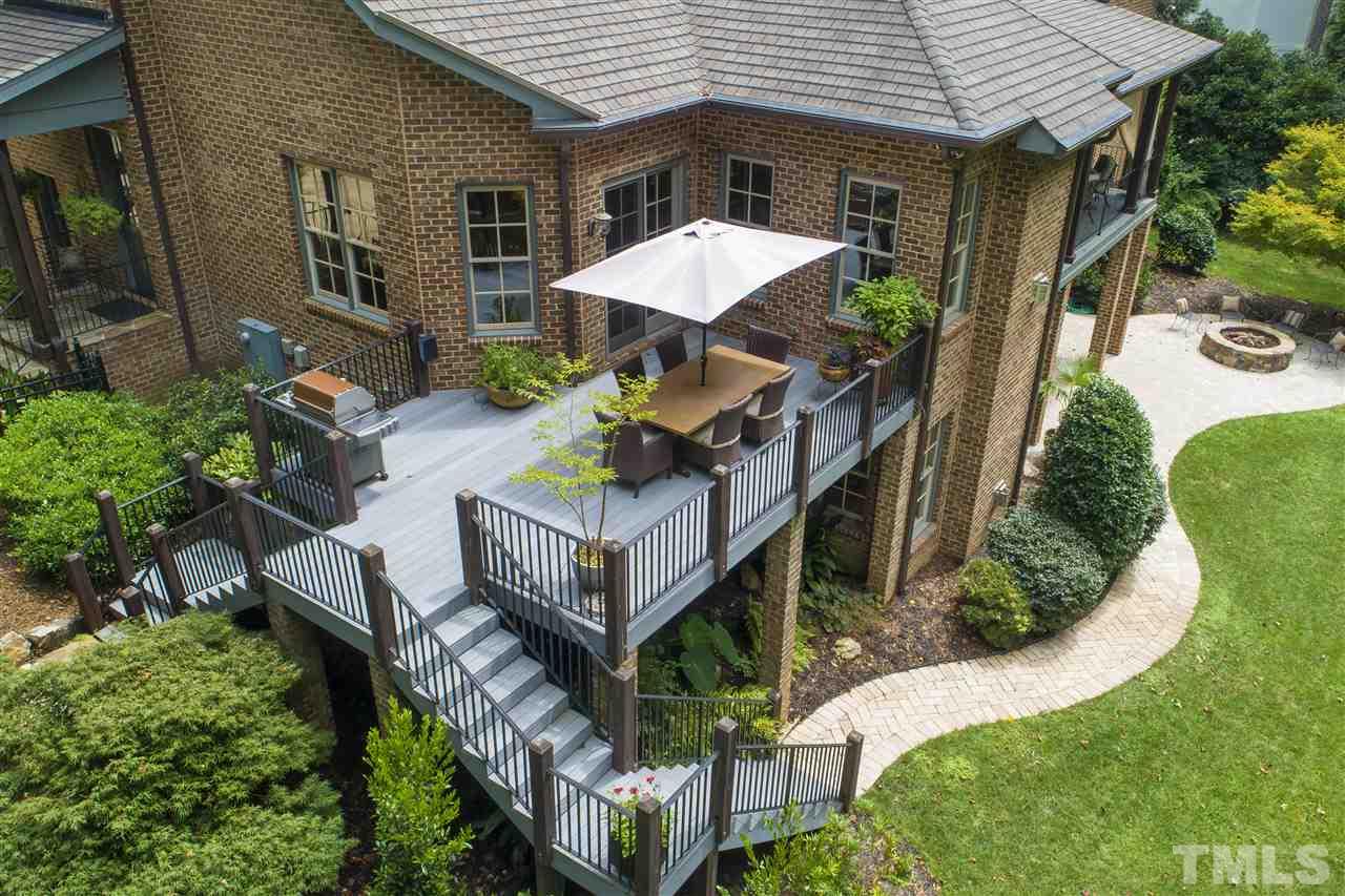 1512 Consett Court Raleigh, NC 27613 - Photo 4 of 30 Off the open kitchen and breakfast room is a large dining and grilling deck