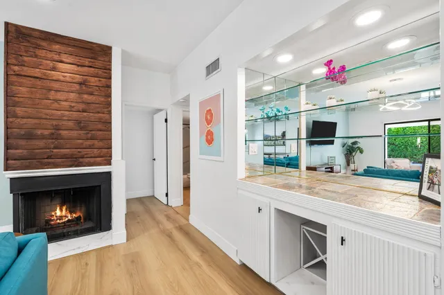 a bedroom with a bed and a potted plant