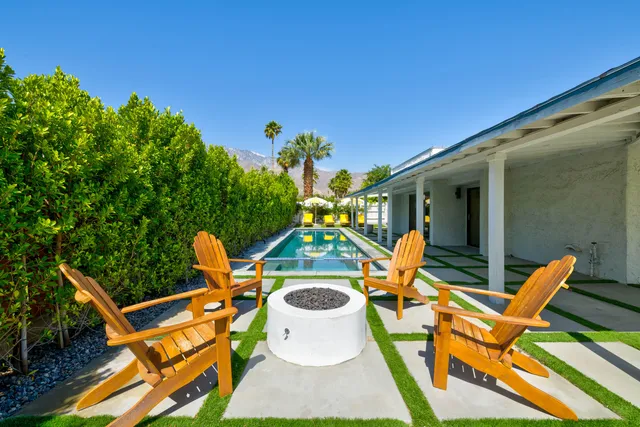 a view of a swimming pool with a patio