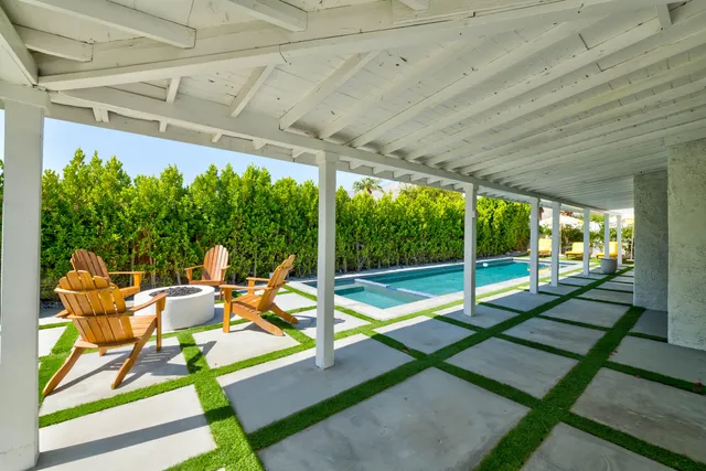 a patio with table and chairs