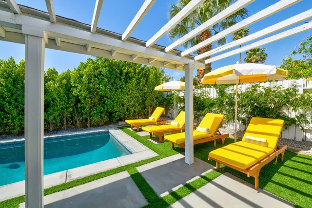 a view of a chairs and table in a patio