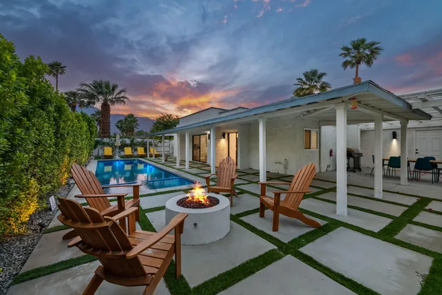 a view of swimming pool with lounge chair