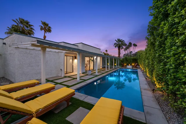 a view of a backyard of the house