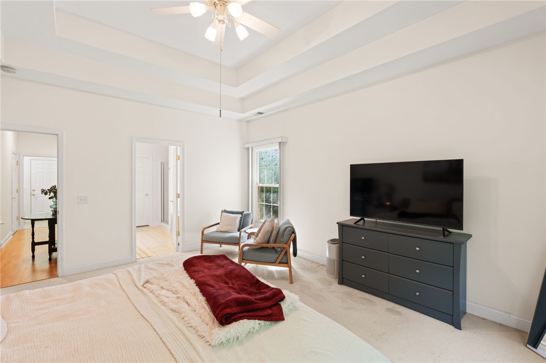 108 Winterbrook Circle Seneca, SC 29678 - Photo 22 of 40 Relax in this primary bedroom featuring a vaulted ceiling and soft carpeted flooring.
