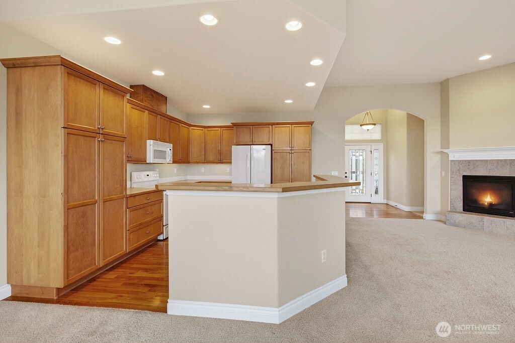 1845 Maple Street, Unit 26 Wenatchee, WA 98801 - Photo 18 of 40 a kitchen with stainless steel appliances a refrigerator and a stove top oven