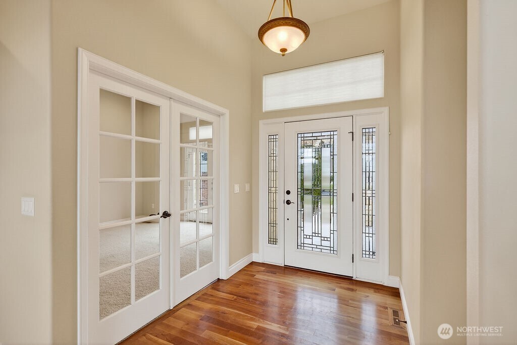 1845 Maple Street, Unit 26 Wenatchee, WA 98801 - Photo 25 of 40 a view of an empty room with wooden floor and a window