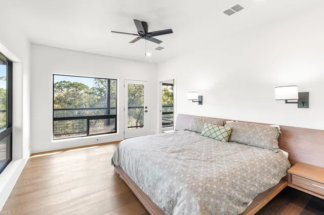a bathroom with a double vanity sink a mirror and a bathtub