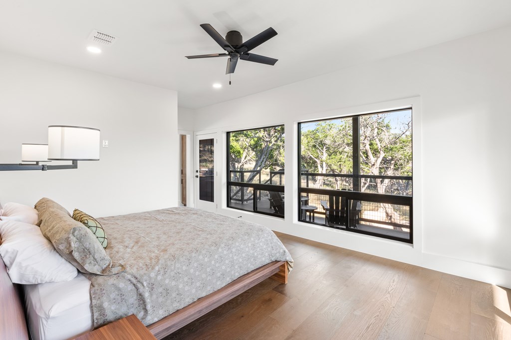 199 Hermosa Road Southwest Hunt, TX 78024 - Photo 17 of 59 a living room with a bed furniture and a large window