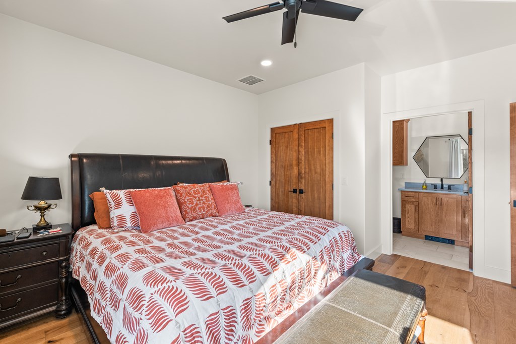 199 Hermosa Road Southwest Hunt, TX 78024 - Photo 28 of 59 a bedroom with a bed and a view of bathroom