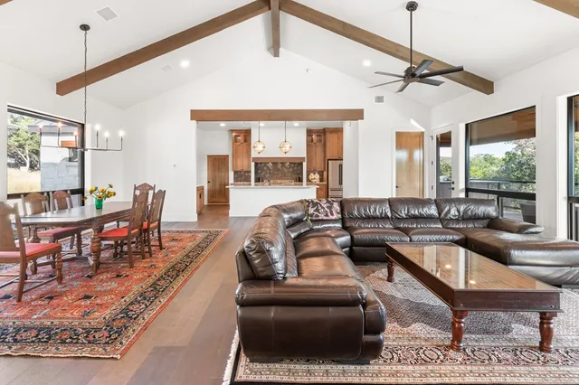 a living room with furniture and a table
