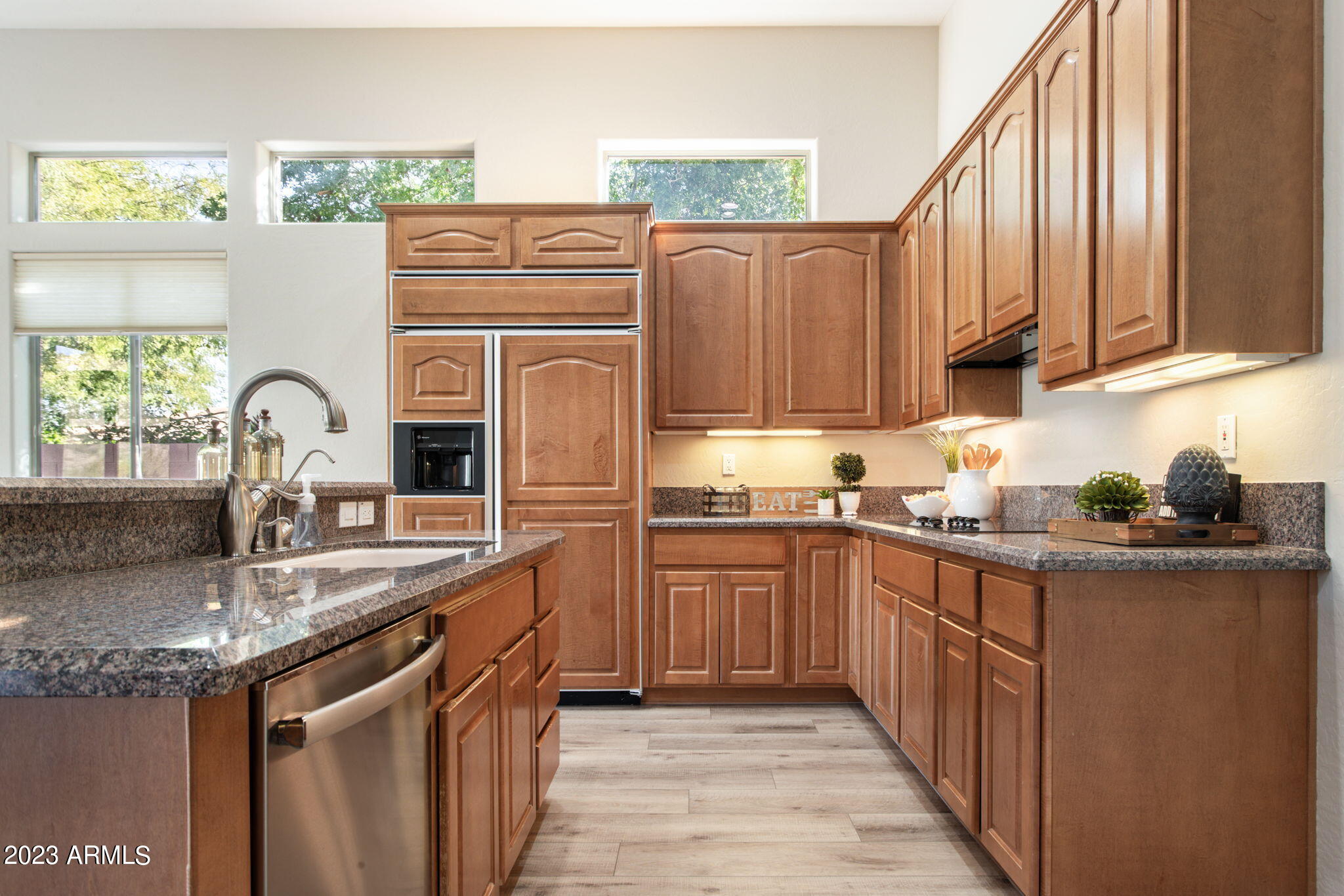 42409 North Back Creek Way Anthem, AZ 85086 - Photo 15 of 87 a kitchen with stainless steel appliances granite countertop a sink a stove and a refrigerator