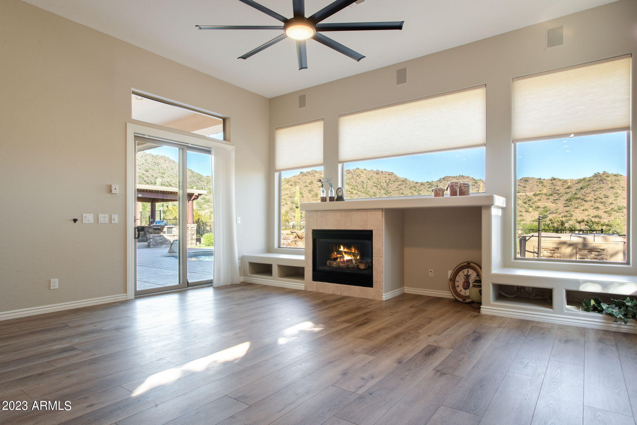 42409 North Back Creek Way Anthem, AZ 85086 - Photo 24 of 87 a view of a livingroom with a fireplace and window